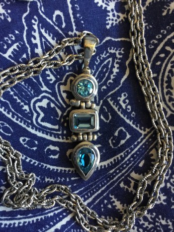Blue topaz and silver pendant.