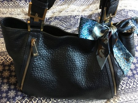 Dans un Jardin Anglais twilly by Hermès tied on Massaccesi handbag